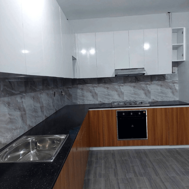 Custom modular kitchen cabinet with wood-grain base cabinets, glossy white overhead storage, and modern L-shaped design.