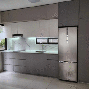 Custom modular kitchen cabinet with modern gray and white finish, built-in storage, and integrated refrigerator design.